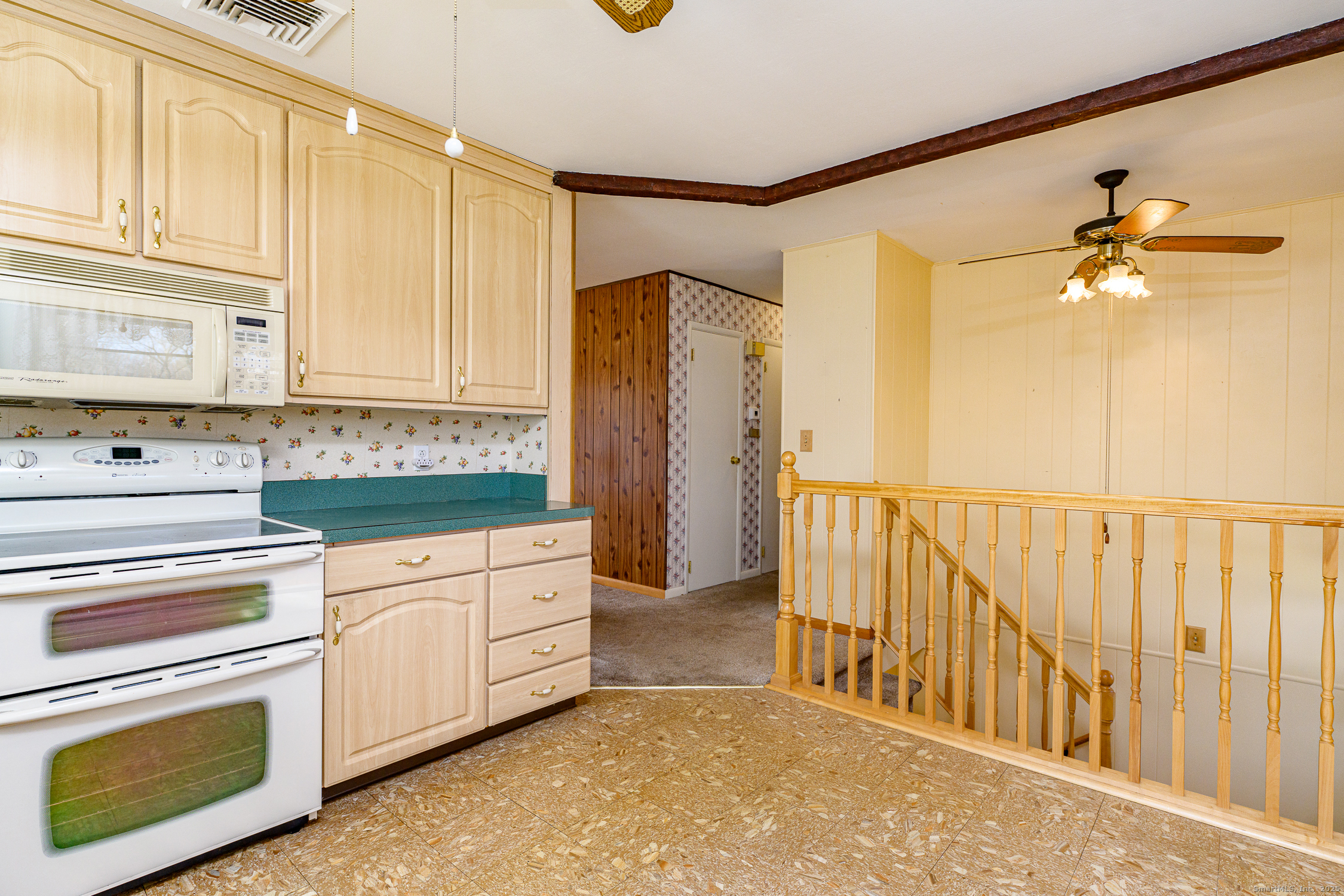 38 Toper Road Plainfield, CT 06374 - Photo 9 of 35 a kitchen with stainless steel appliances white cabinets and a refrigerator