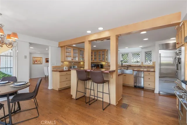 a kitchen with stainless steel appliances granite countertop a sink and stove