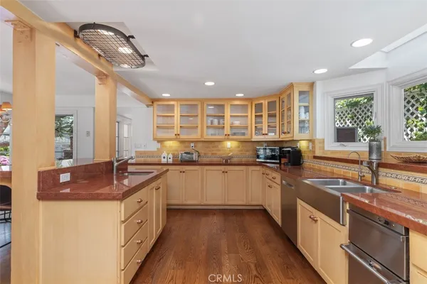 a view of a dining room with furniture wooden floor and chandelier