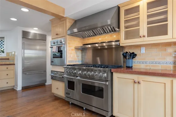 a living room with furniture a rug and white walls