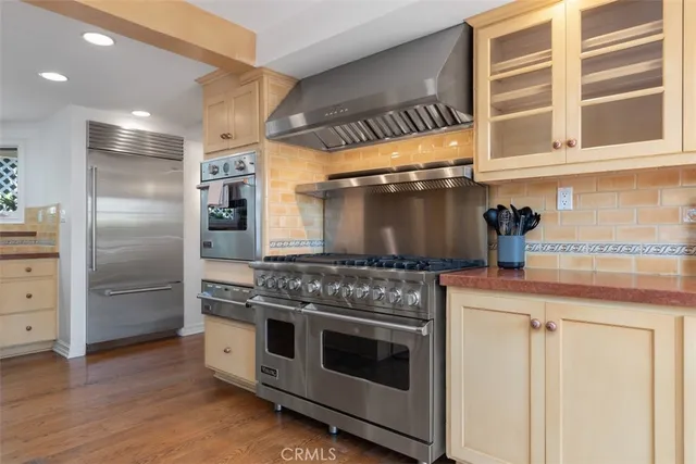 a living room with furniture a rug and white walls