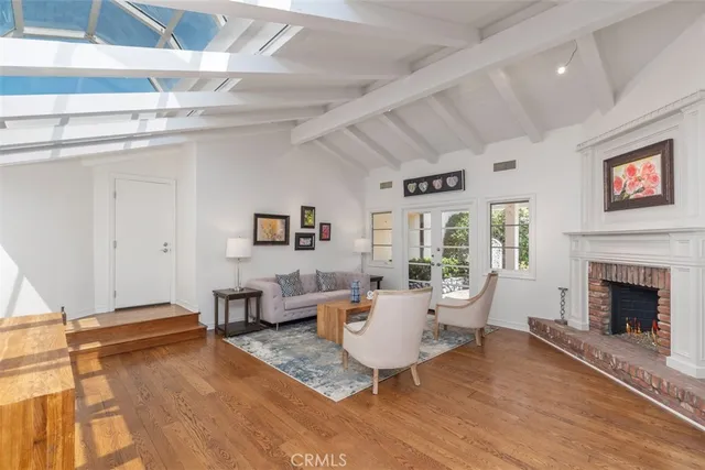 a spacious bedroom with a bed and glass window
