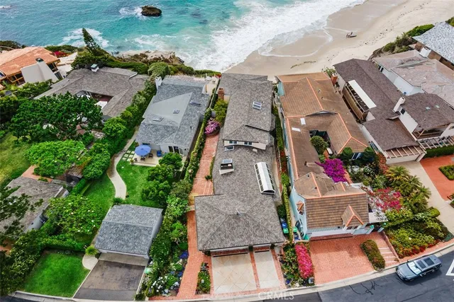 a front view of a house with a yard garage and a fireplace
