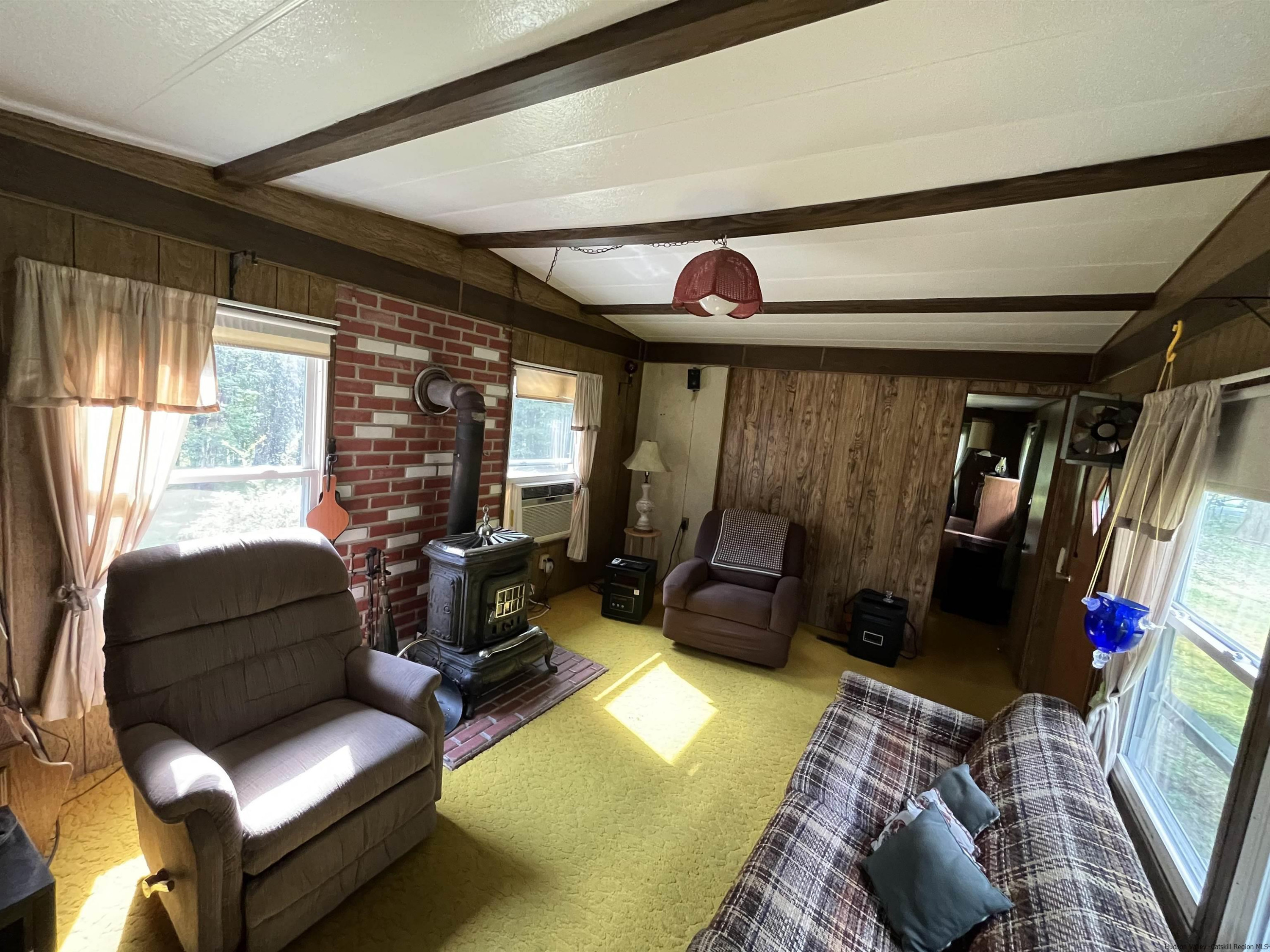 1882 High Falls Road Catskill, NY 12414 - Photo 7 of 18 a living room with furniture and a large window