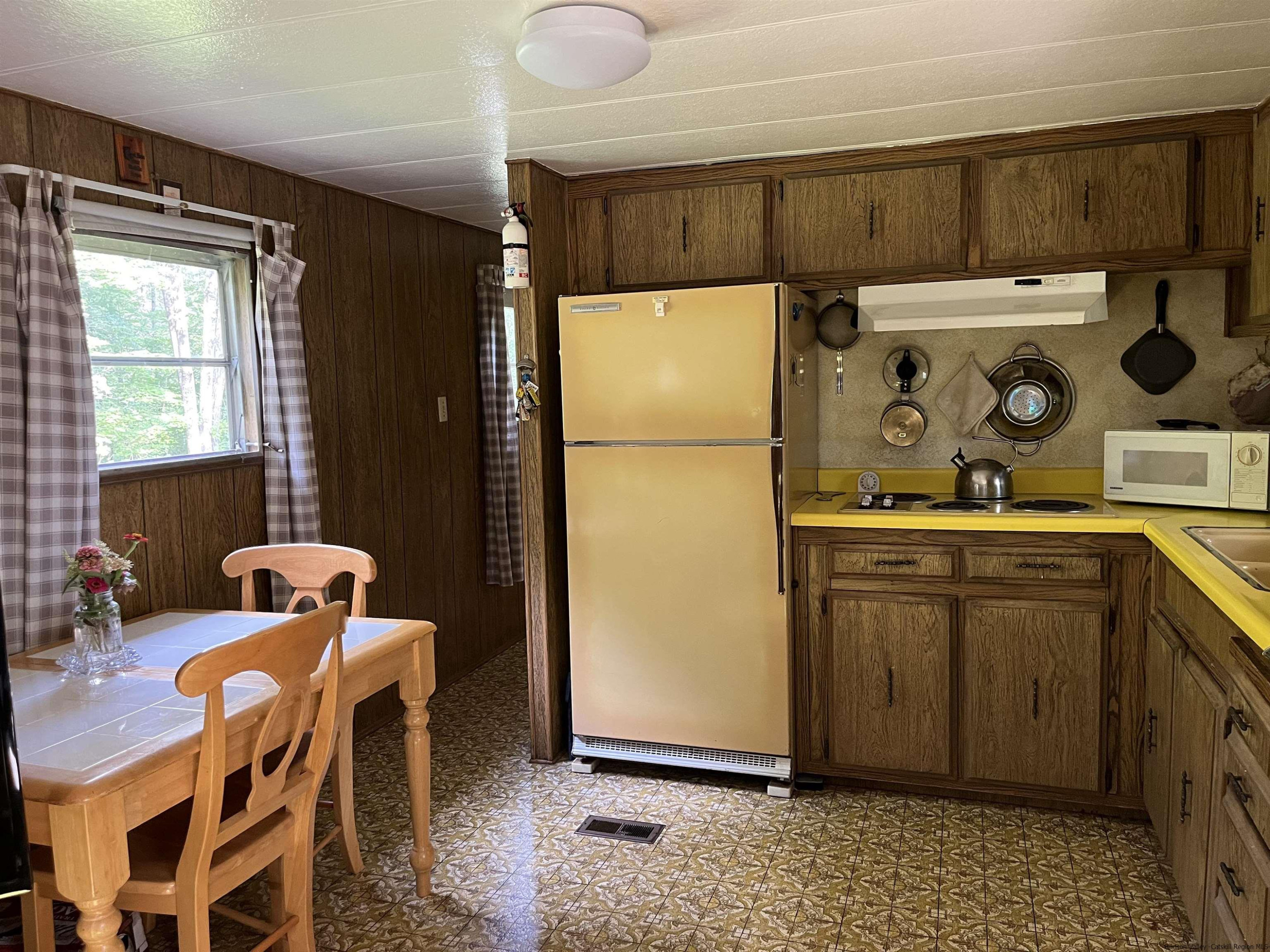 1882 High Falls Road Catskill, NY 12414 - Photo 8 of 18 a kitchen with stainless steel appliances granite countertop a refrigerator and a stove