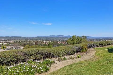 a view of a lake with mountains in the background