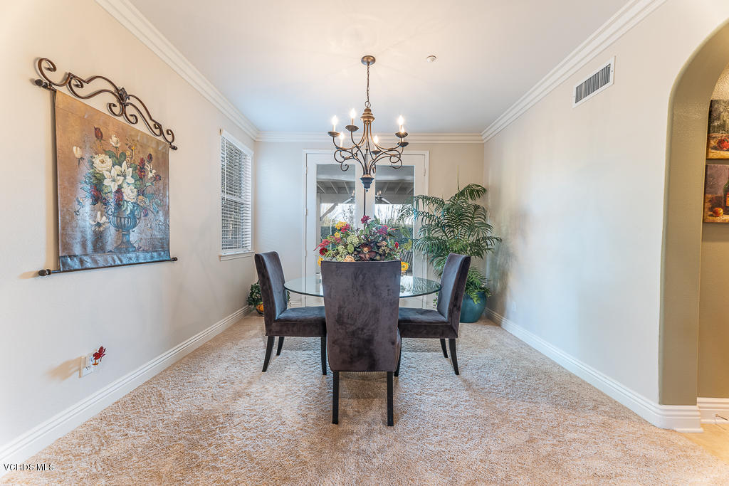 14176 Maya Circle Moorpark, CA 93021 - Photo 11 of 53 a view of a dining room with furniture and chandelier