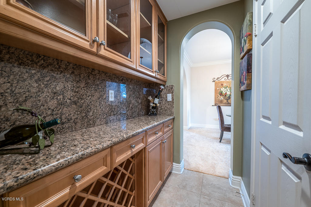 14176 Maya Circle Moorpark, CA 93021 - Photo 18 of 53 a kitchen with a sink and cabinets