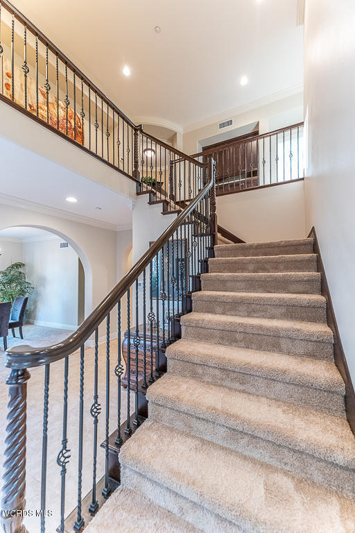 14176 Maya Circle Moorpark, CA 93021 - Photo 19 of 53 a view of staircase with lots of frames on wall and a window