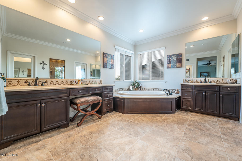 14176 Maya Circle Moorpark, CA 93021 - Photo 24 of 53 a spacious bathroom with a tub sink double vanity and mirror
