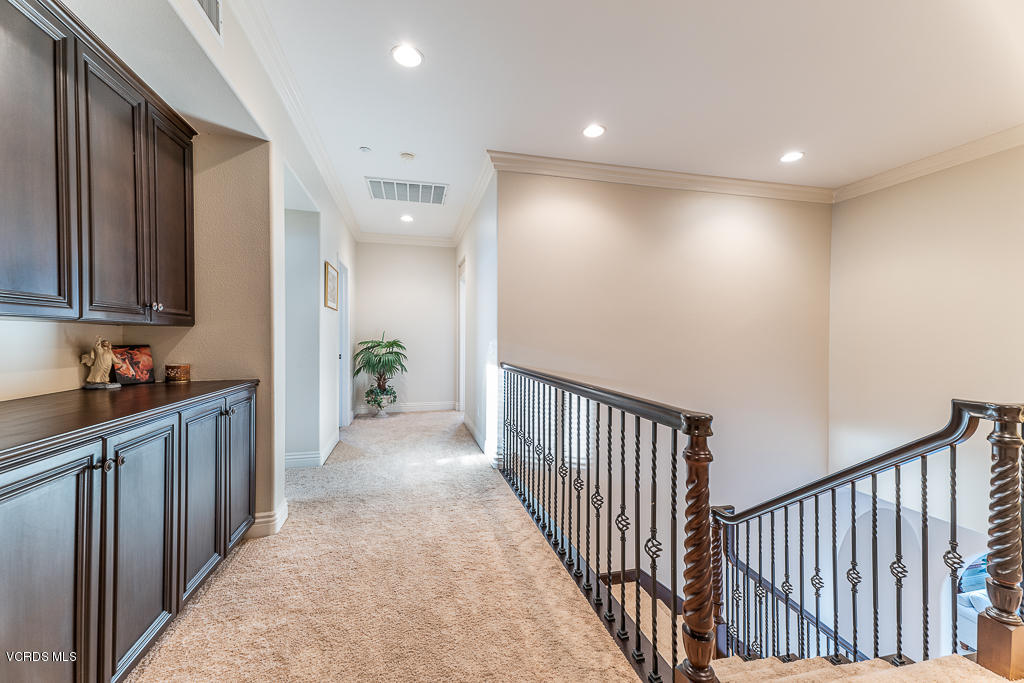 14176 Maya Circle Moorpark, CA 93021 - Photo 30 of 53 a view of a hallway with stainless steel appliances a sink and a refrigerator
