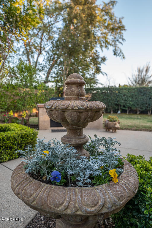 14176 Maya Circle Moorpark, CA 93021 - Photo 47 of 53 a view of a garden with a fountain and a fire pit