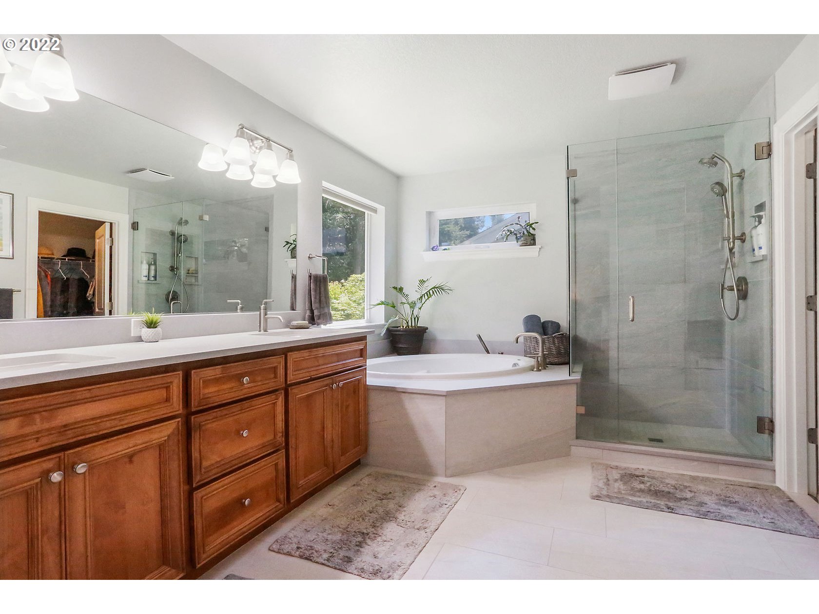 1773 Joseph Fields Street West Linn, OR 97068 - Photo 18 of 32 a bathroom with a tub sink shower and mirror