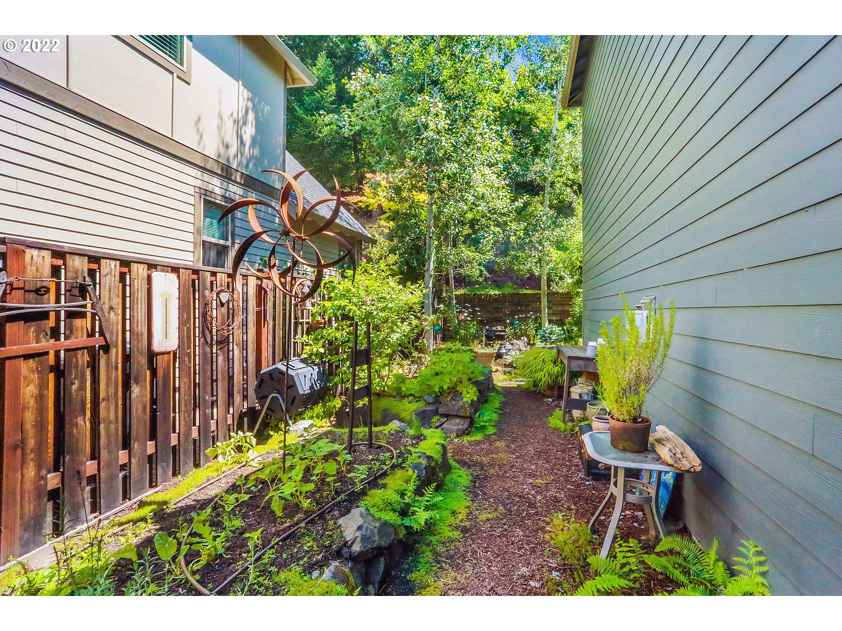 1773 Joseph Fields Street West Linn, OR 97068 - Photo 29 of 32 a view of a chair and table in patio with potted plants