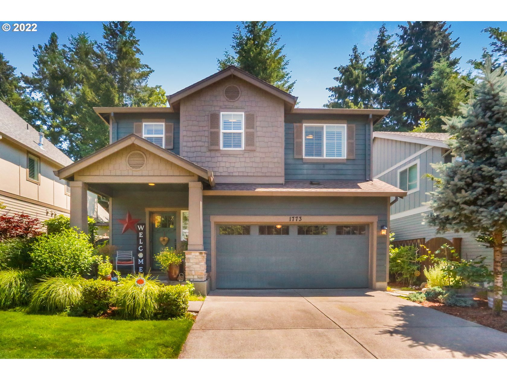 1773 Joseph Fields Street West Linn, OR 97068 - Photo 3 of 32 a view of a house with brick walls and potted plants