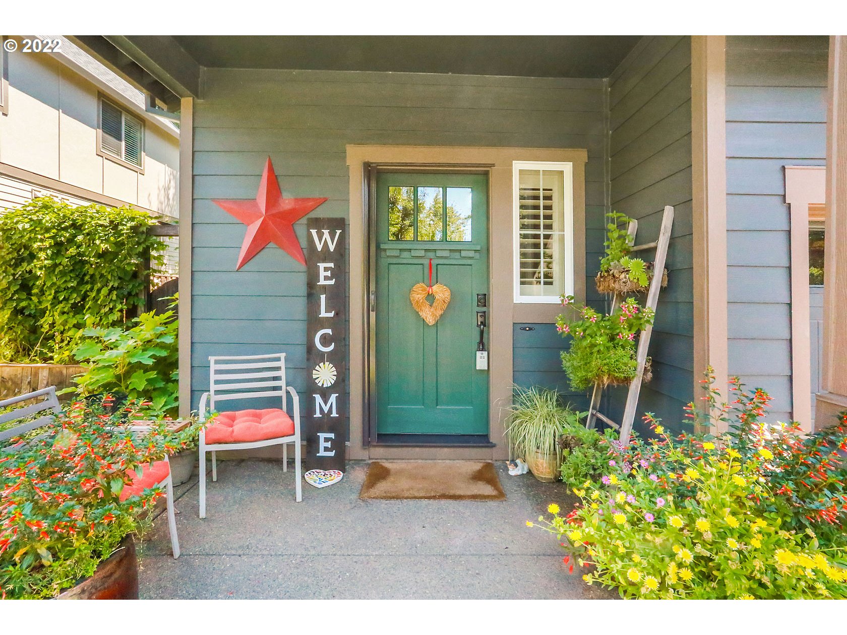 1773 Joseph Fields Street West Linn, OR 97068 - Photo 4 of 32 a view of a house with potted plants and a bench