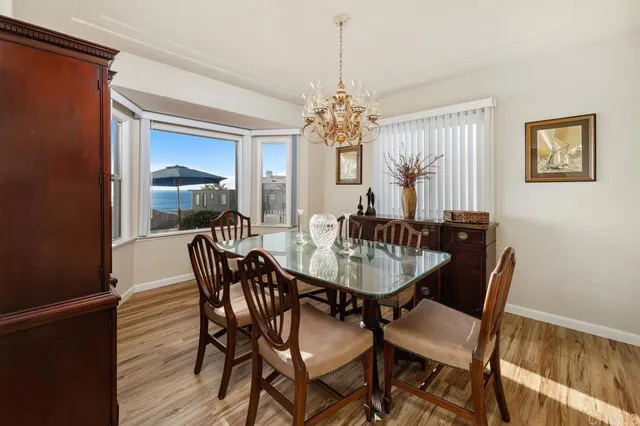 a kitchen with stainless steel appliances granite countertop sink refrigerator and cabinets