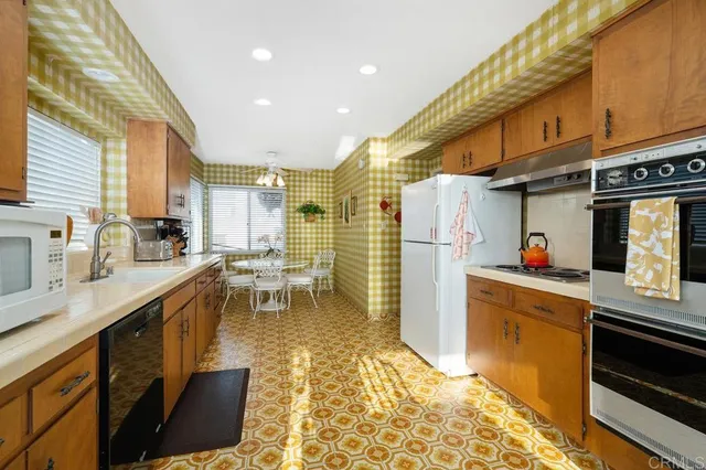 a spacious bathroom with a double vanity sink a mirror and a shower