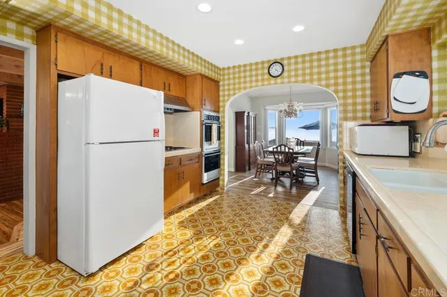 a room with pool table and windows