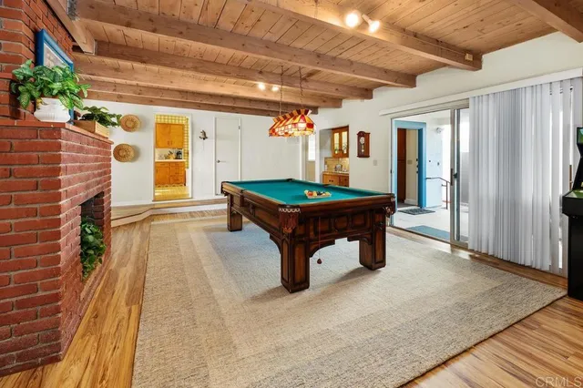 a reading room with furniture and a rug