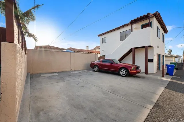 a view of backyard with swimming pool and furniture