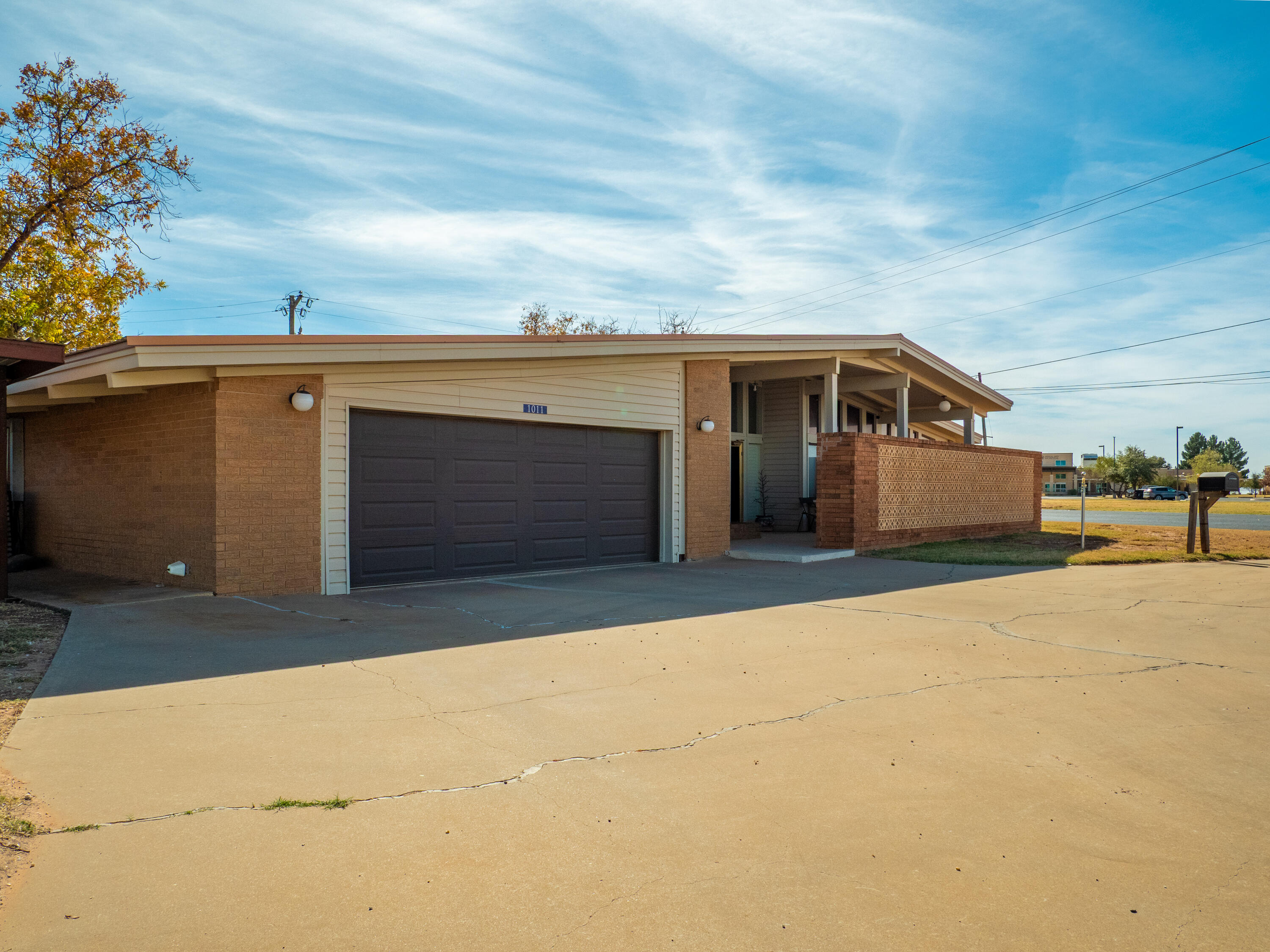 a front view of a house with a garage
