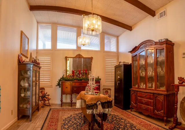 a view of a livingroom with furniture and chandelier