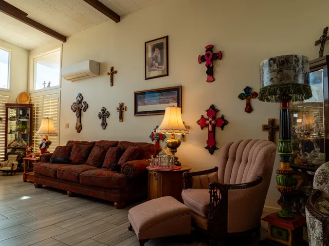 a living room with furniture flowerpot and window