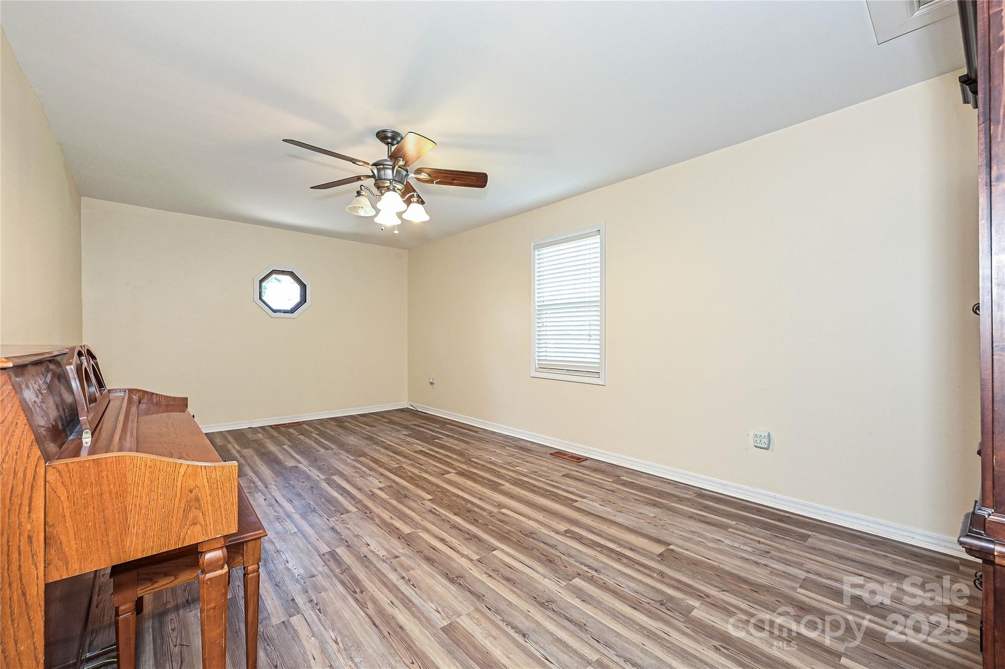7705 Red Robin Trail Denver, NC 28037 - Photo 13 of 27 a bedroom with a bed and a chandelier