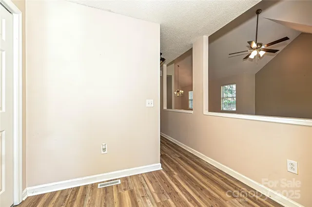 a view of a hallway with a window
