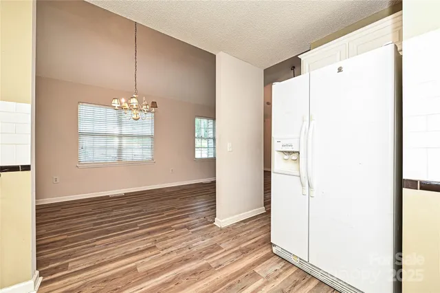 a view of livingroom with hardwood floor and hallway