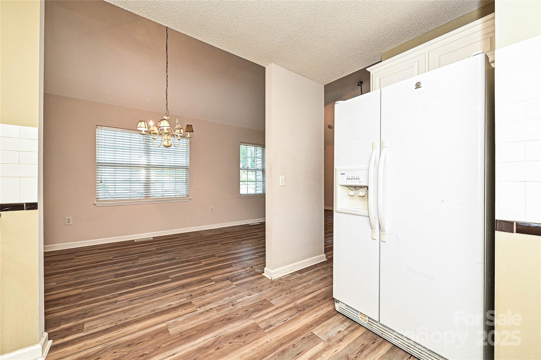 7705 Red Robin Trail Denver, NC 28037 - Photo 9 of 27 a view of livingroom with hardwood floor and hallway