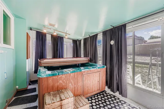 a view of outdoor space with wooden floor and furniture