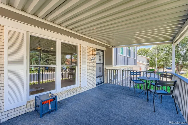 a view of a porch with chairs and floor