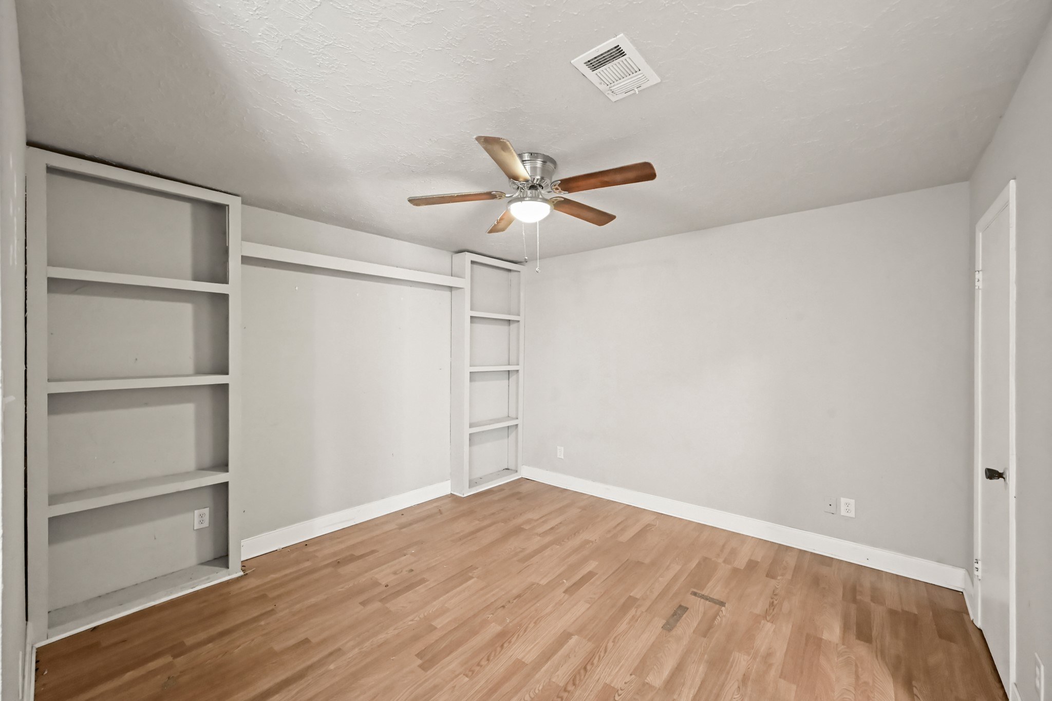 19302 Pocito Court Humble, TX 77346 - Photo 18 of 28 Bedroom with built-in shelving