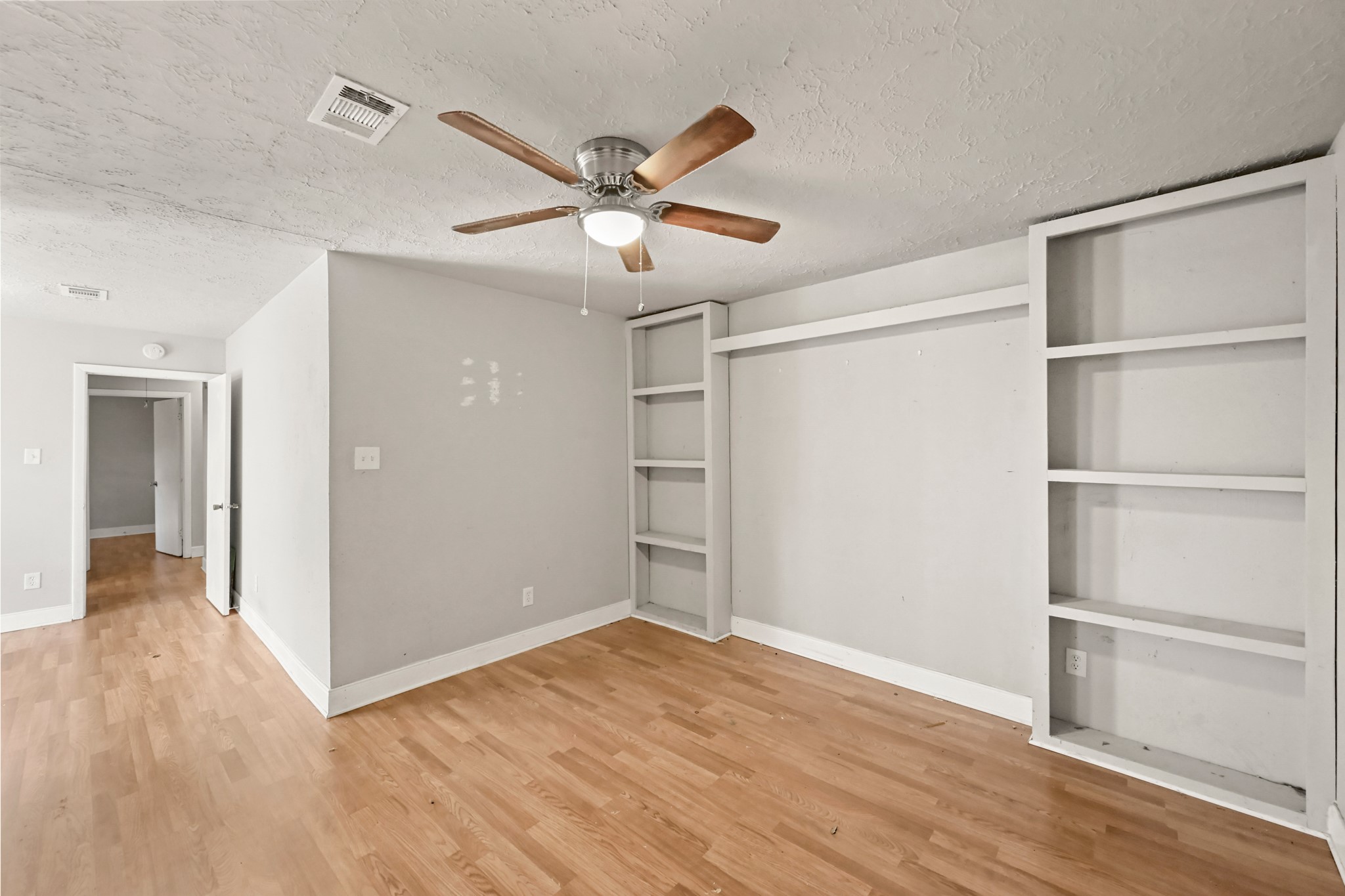 19302 Pocito Court Humble, TX 77346 - Photo 19 of 28 Another view of bedroom with built-in shelving.