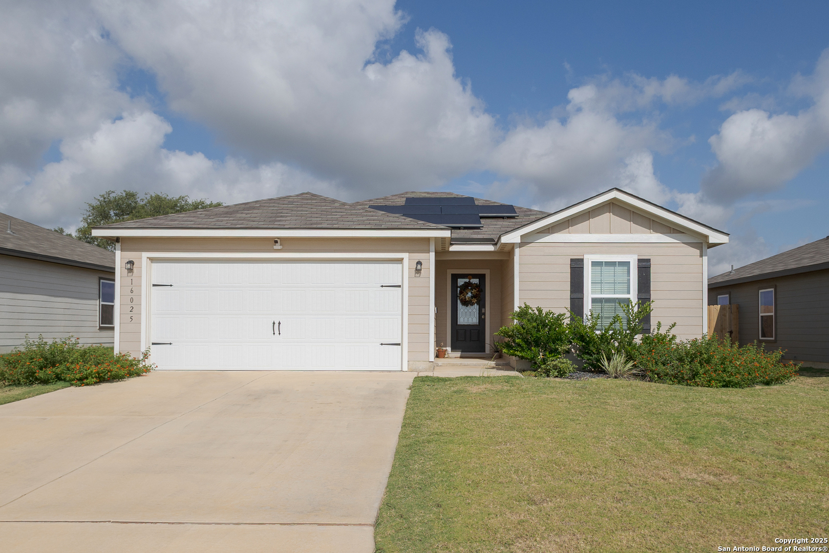 16025 Dickens Lytle, TX 78052 - Photo 2 of 15 a view of a house with potted plants and a large tree