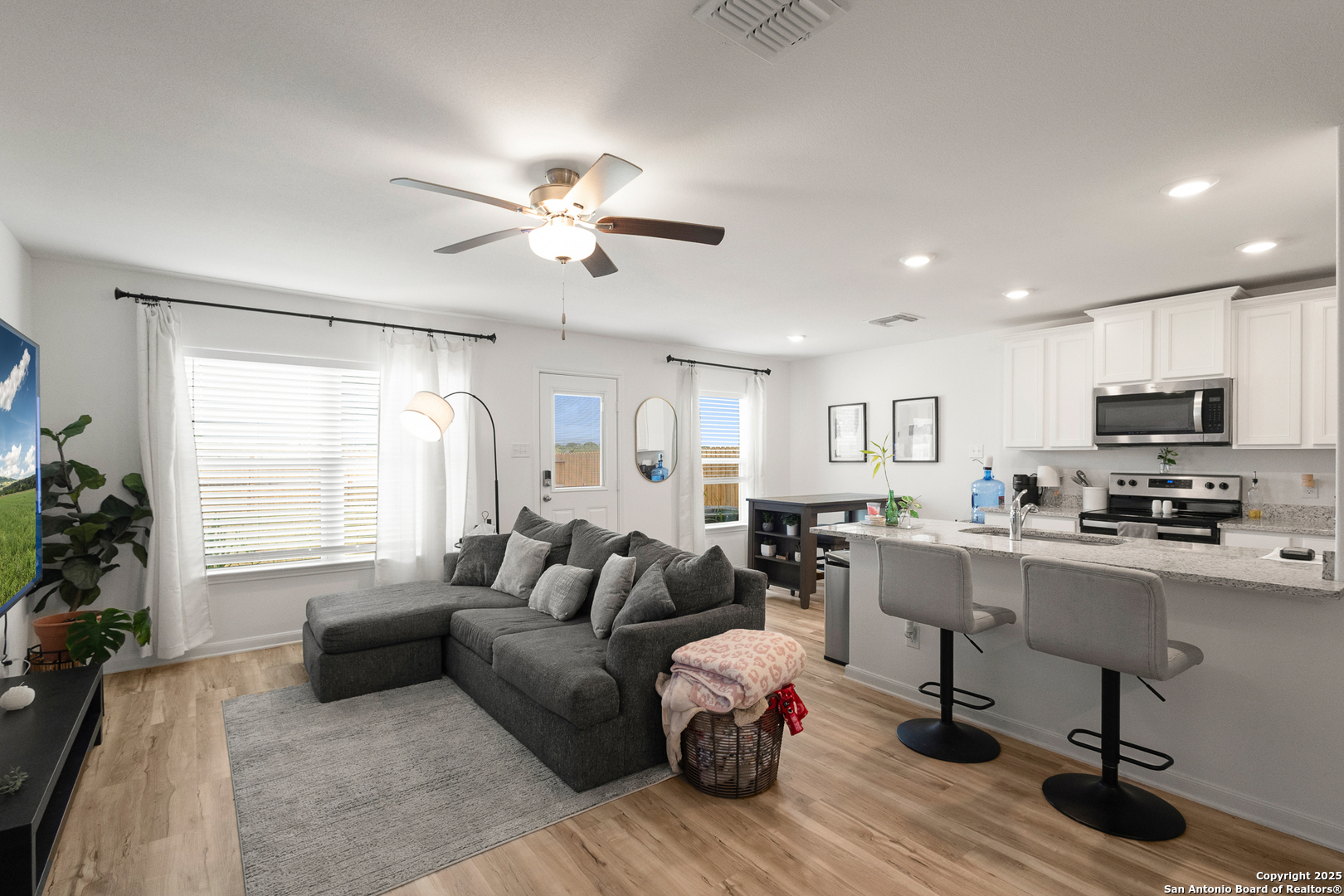 16025 Dickens Lytle, TX 78052 - Photo 4 of 15 a living room with furniture flat screen tv and window