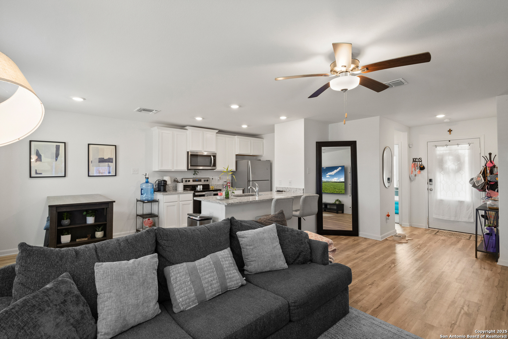 16025 Dickens Lytle, TX 78052 - Photo 6 of 15 a living room with furniture a fireplace and a flat screen tv