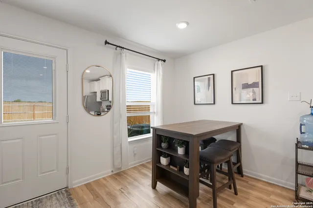 a room with a table and chairs