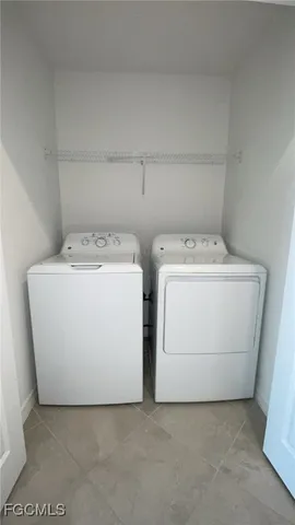 a view of an empty room with a fireplace