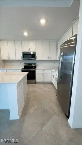 an empty room with a empty space and windows