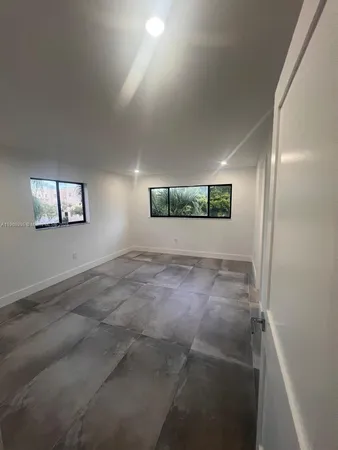 an empty room with windows