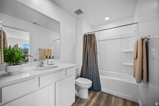2202 Wolverine Way, Unit 2529 Washington, UT 84780 - Photo 27 of 27 Bathroom featuring a single vanity with a white countertop, chrome faucet, and a large wall-mounted mirror