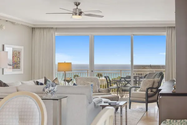 a very nice looking dining room with a large window and dining table