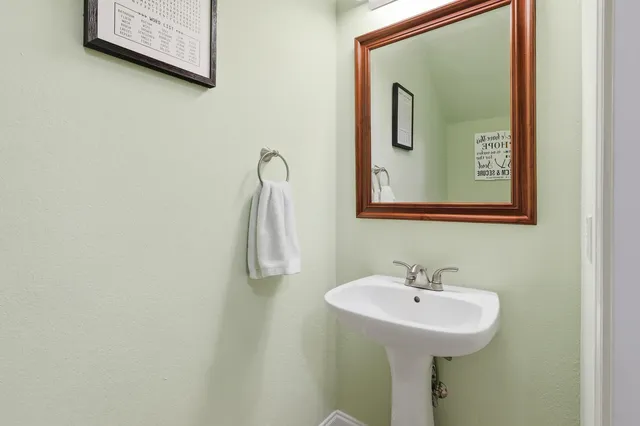 a white toilet sitting next to a bathroom sink