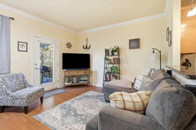 a open kitchen with stainless steel appliances granite countertop a stove refrigerator and cabinets
