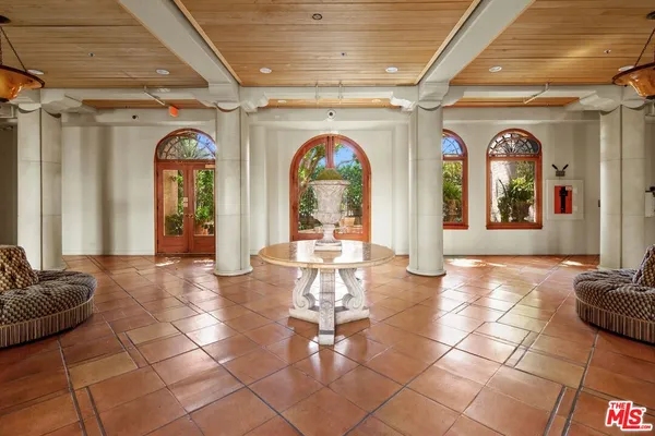 a lobby with furniture and window