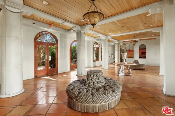 a view of a patio with table and chairs and couches