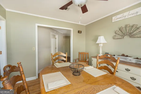 a bedroom with furniture and a wooden floor